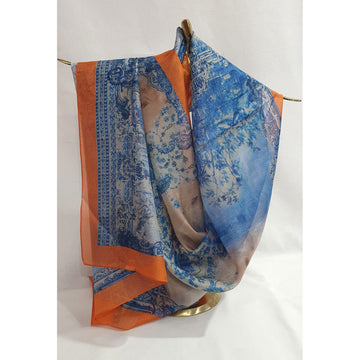 Blue and orange patterned scarf draped over a gold rod on a white background.