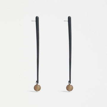 A pair of stud drop earrings with a long narrow bar in dark green with a gold round bead on the end.