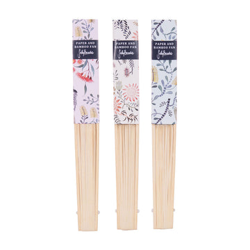 Three bamboo fans pictured folded up. Each has a different floral printed label over the fan.