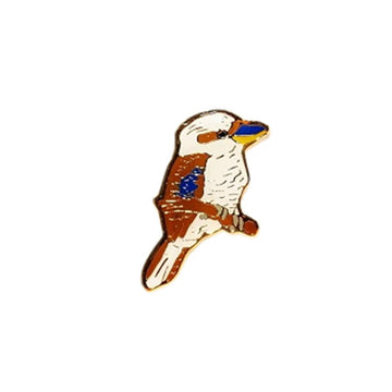 An enamel pin shaped like a kookaburra.