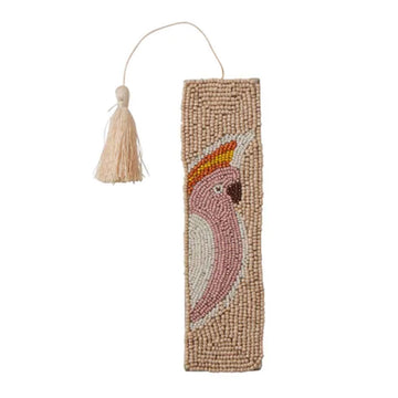 Decorative bookmark with a beaded design of a bird and a tassel on a white background.
