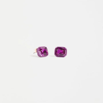 A pair of stud earrings shaped like a pink jewel.
