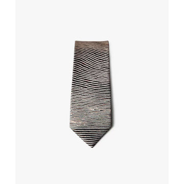 A silk tie rolled up printed with black lines by Walimpirrgna Tjapaltjarri.