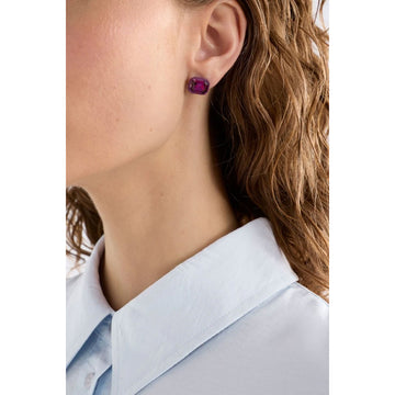 A pair of stud earrings shaped like a pink jewel.