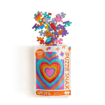 A packet with puzzle pieces coming out of the top. The packet has an illustration of a heart with colourful borders.