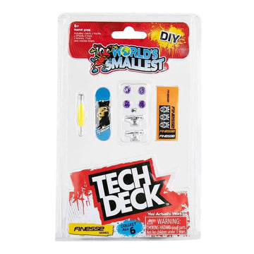 The world's smallest tech deck skateboard with tools and wheels to attach in clear packaging surrounded by product information.