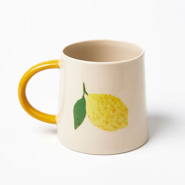 A ceramic mug illustrated with a lemon on the front.