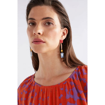 A pair of drop earrings featuring red, yellow and blue rectangles in different sizes linked together.