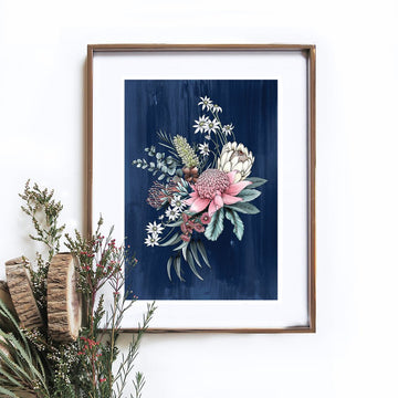 An illustrated bouquet of flowers on a navy background in a gold frame hanging on the wall. There is flowers in the bottom right corner.