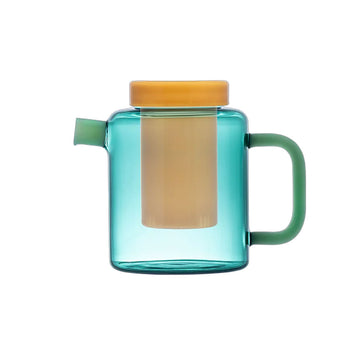 Green glass pot with a yellow lid and infuser on a white background.