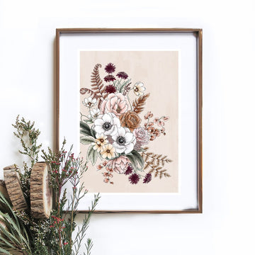 An illustrated bouquet of flowers on a beige background in a gold frame hanging on the wall. There are flowers in the bottom left corner.