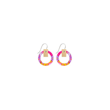 A pair of drop earrings with a circle outline printed with floral artwork.