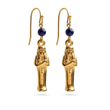 A pair of drop earrings in gold in the shape of mummies.