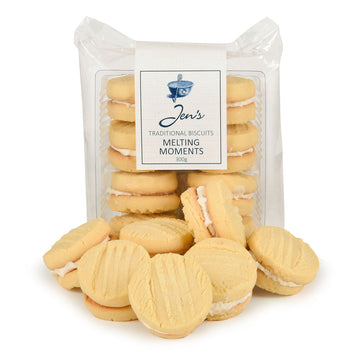 A packet of melting moment biscuts with clear packaging is standing up at the back and there are loose biscuits in front.