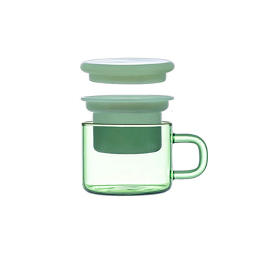 Green mug with a matching lid on a beige background.