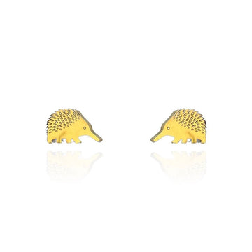A pair of gold stud earrings in the shape of echidnas.