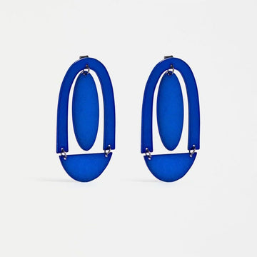 A pair of stud earrings with a large arch and circle shape in blue.