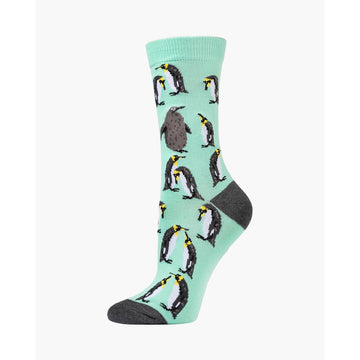 Sock with penguin pattern on a light green background.