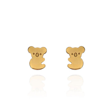 A pair of gold stud earrings in the shape of a koala.