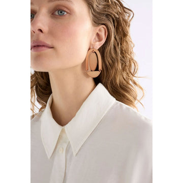 A pair of stud earrings with a large arch and circle shape in bronze.