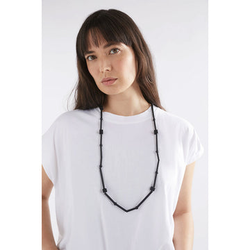 A necklace made up of long cylinder beads with circular and square beads in between all in black.