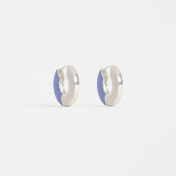 Pair of silver hoop earrings with blue accents on a white background.
