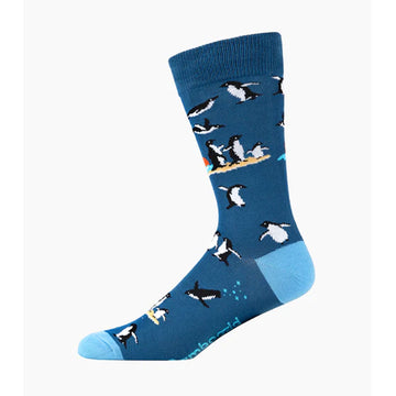 Blue sock with penguin design on a white background.