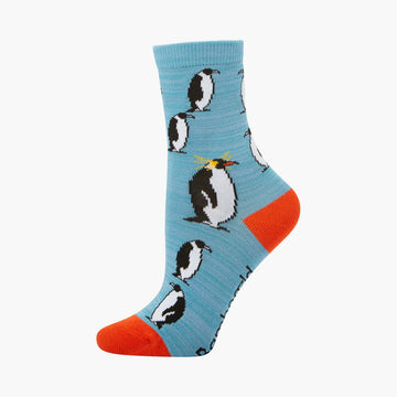 Sock with penguin design on a light blue background.
