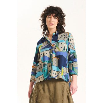 Colorful patterned shirt with geometric design on a white background.