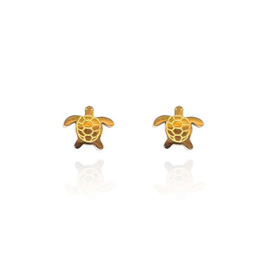 A pair of gold studs shaped like turtles.