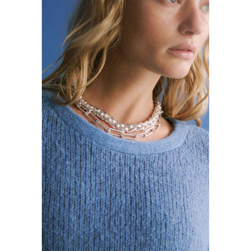 Silver chain necklace on a white background.