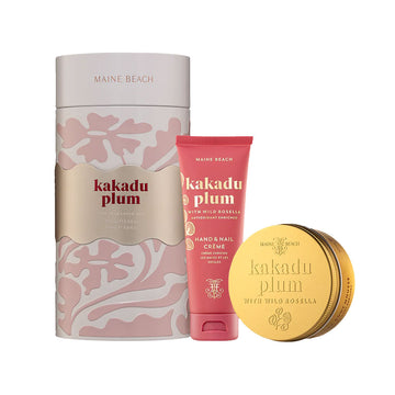 A tall round tin in pink next to a pink red tube and gold round tin. Each item has the text 'kakadu plum' written on it.