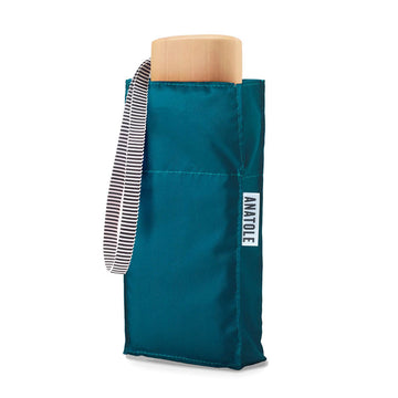 A folded up umbrella in a square shaped pouch in teal blue.