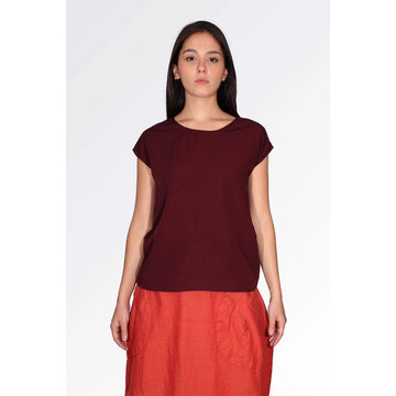 Maroon short sleeve top on a white background.