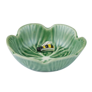 Green ceramic leaf-shaped bowl with a bee design on a white background.