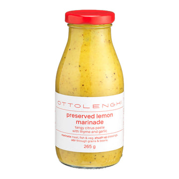 Bottle of Ottolenghi preserved lemon marinade with a red lid on a white background.