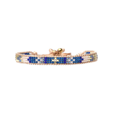 Beaded bracelet with blue and white pattern on a white background.