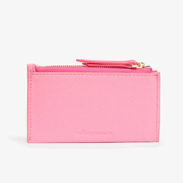 Front view of a wallet in pink leather with a top zipper.