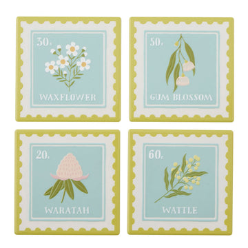 Four coasters with floral designs and text on a white background.