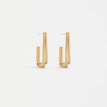 Gold hoop earrings on a white background.