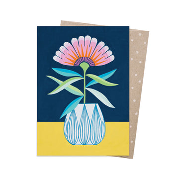 Greeting card with a colorful floral design on a blue and yellow background.