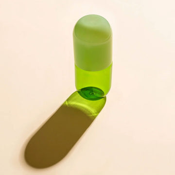 A green glass carafe.