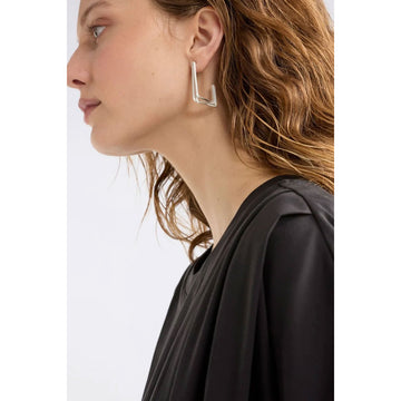 Gold hoop earrings on a white background.