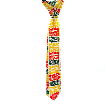 A tie printed with artwork by Mitjili Napurrula with motifs in yellow, red and green.