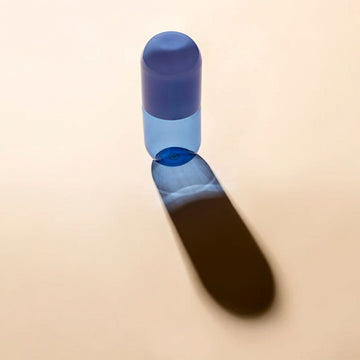 A blue glass carafe.