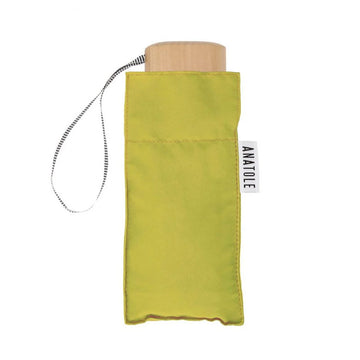 A folded up umbrella in lime green in a square shaped pouch.