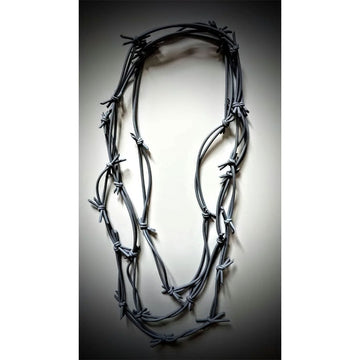A necklace in black featuring tied together rubber strands with ends that look spiky.