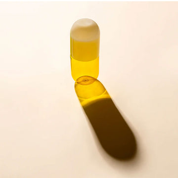 A yellow glass carafe.