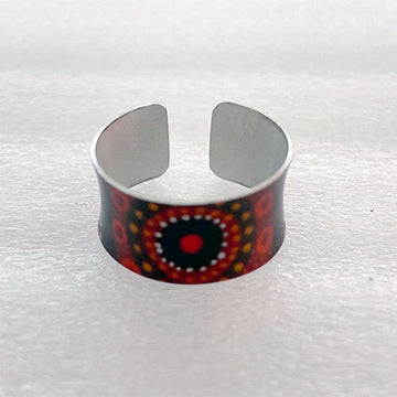 Cuff ring with a colorful pattern on a white background.