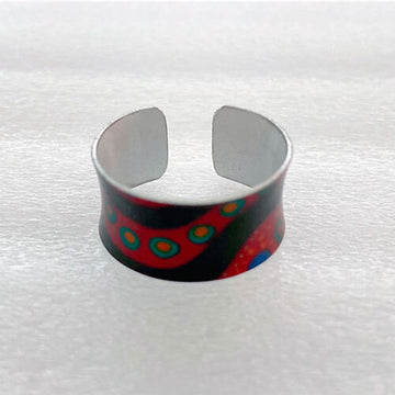 Cuff ring with colorful pattern on a white background.
